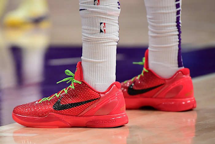 View of Anthony Davis' red and black Nike Kobe shoes.
